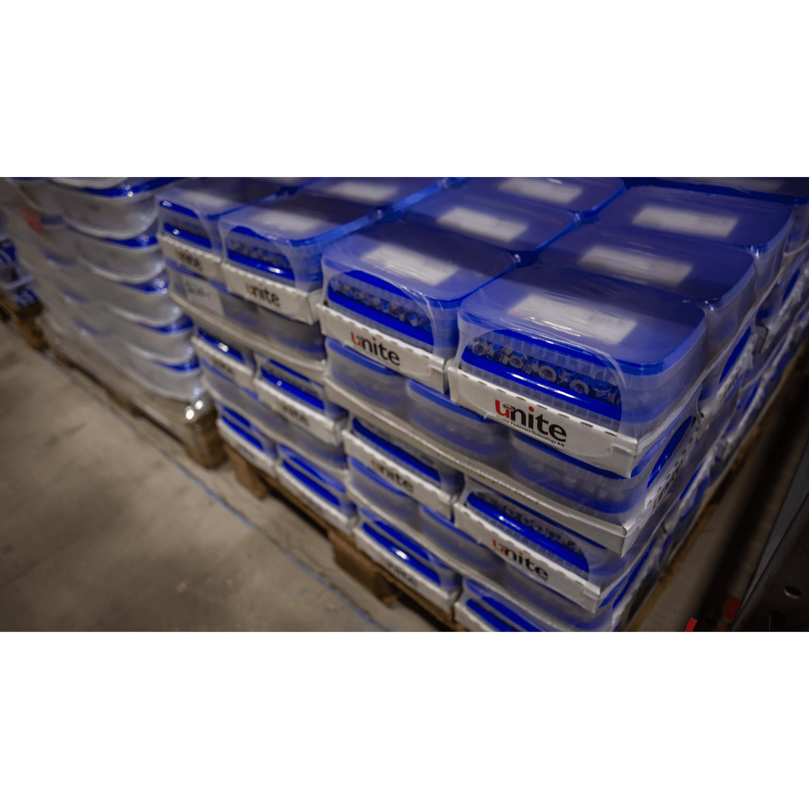 Unite project supply solutions Stacked Unite fastener boxes on pallets in the warehouse.